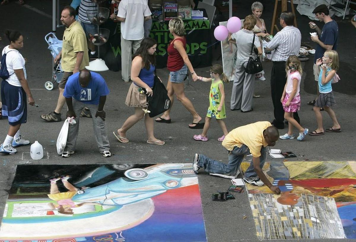 Chalk drawings take over Fayetteville Street in downtown Raleigh during the SparkCon festival of ideas and art.