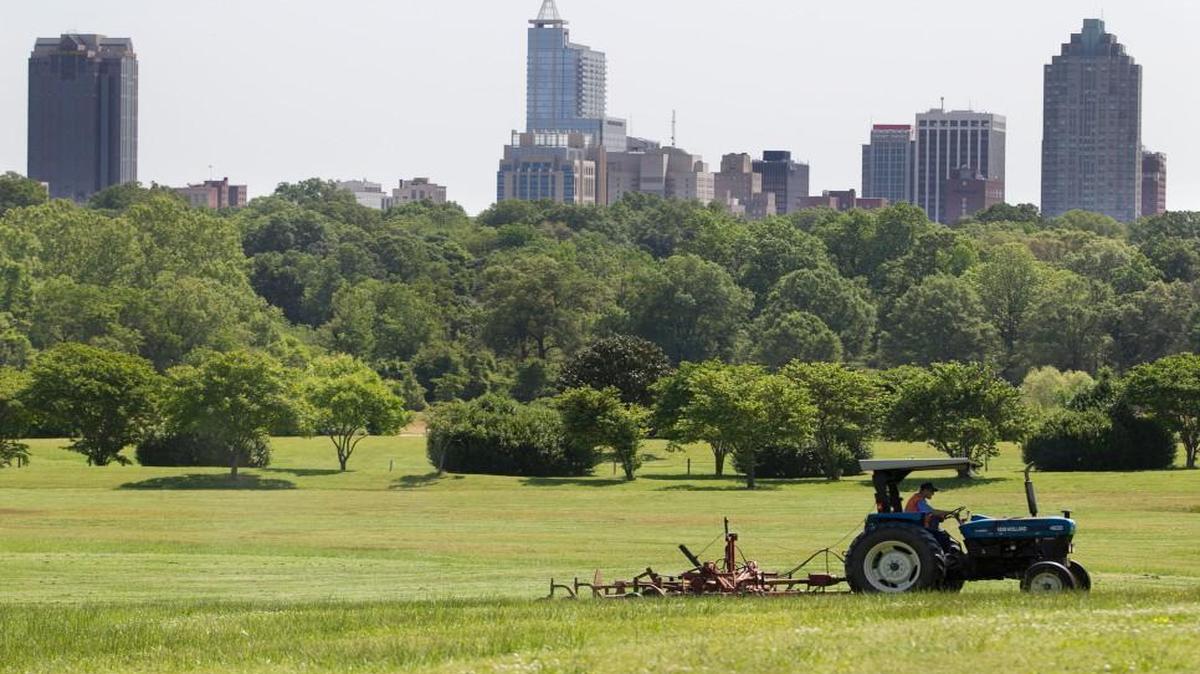 Kenneth Johnson, a state employee assigned to Dix maintenance, mows a large meadow in 2015. Breathtaking seems the best adjective for the 308-acre Dix property Raleigh recently acquired from the state for $52 million.