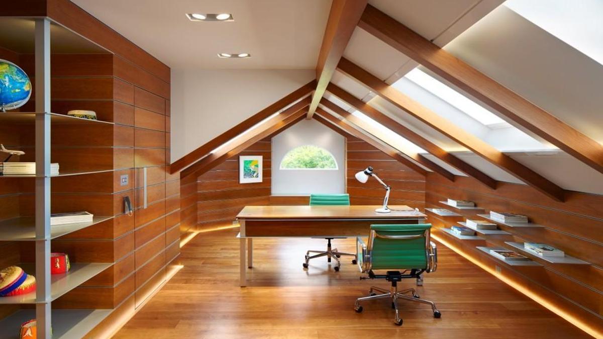 The Garrett is a renovation for an attic space atop a 1990s home in Cary, completed in 2014 by Alphin Design Build. The clients asked for a flexible room that could double as an adult study or a sleepover space for children.