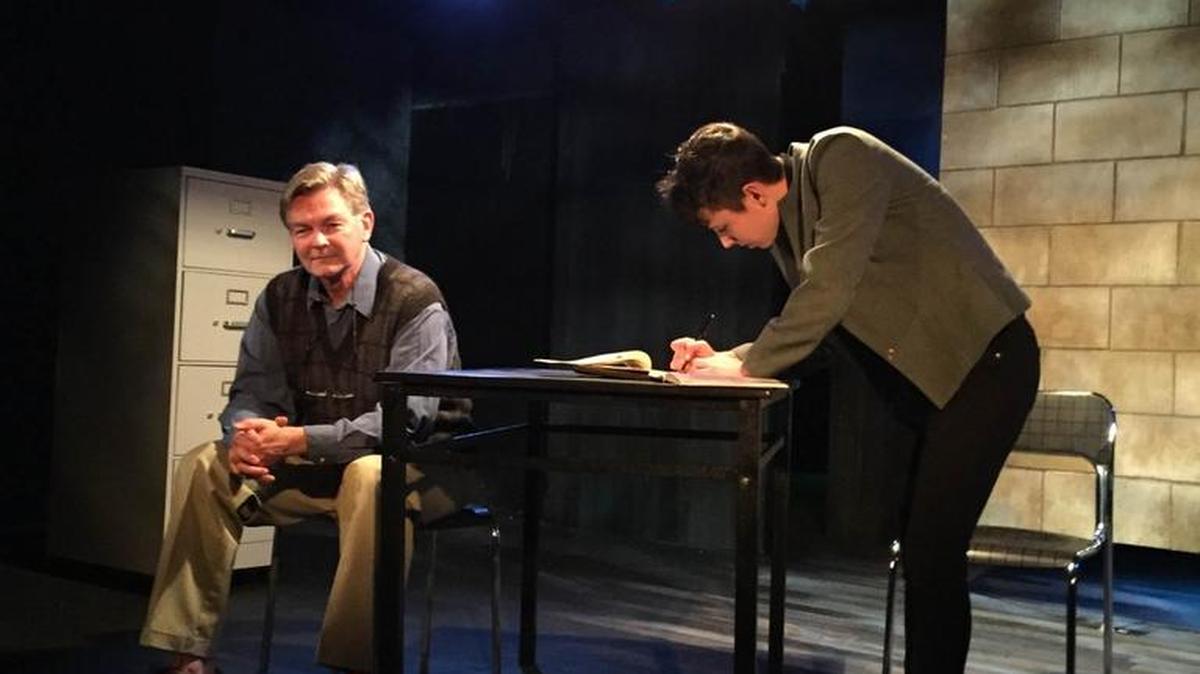 From left, Doyle, played by Michael Foley, is interrogated by Detective Morris, played by Caitlin Wells, about a secret online domain in Manbites Dog Theater’s production of “The Nether,” a near-future immersive virtual reality.