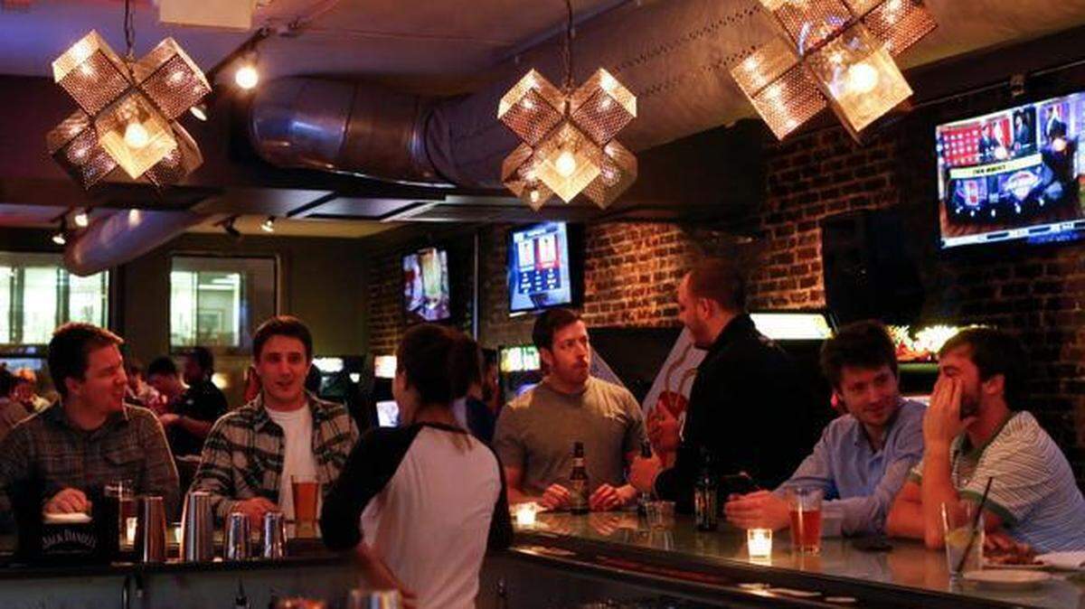 Patrons enjoy drinks at Level Up Kitchen + Barcadium in Raleigh in 2015. Level Up will close this fall and become cocktail bar The Merchant, also from owner Local Icon Hospitality.