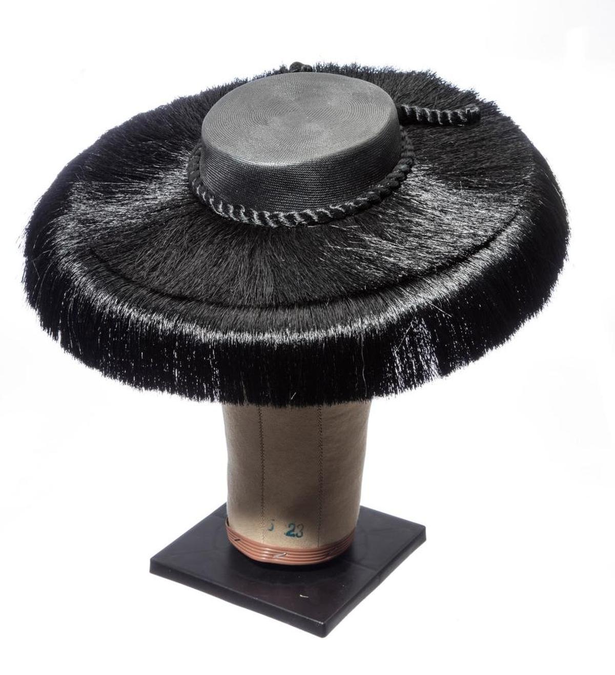 The vintage straw platter hat worn by Chistine Ebersole in “War Paint.”