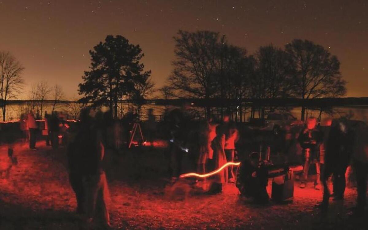 A long exposure image taken of the public looking through the telescopes at Jordan Lake.