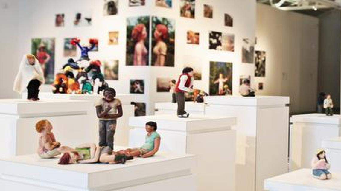 
Sarah Anne Johnson's exhibit, "Wonderland", combines her diverse body of work from photographs to sculpey figurines to handcrafted doll-houses. The exhibit will be open at CAM in Raleigh until May.

