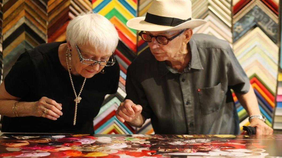 Photographer Burk Uzzle, right, meets with patron, Harriet Herring, to look over a mounted print of “Congregation Ladies” for approval before framing it at Craven Allen Gallery in Durham Aug. 11, 2016. Herring purchased the print to gift to NCMA and it is currently on loan at the Greenville Museum of Art exhibit, “Perceptions and Recognitions: African Americans of Eastern North Carolina.”