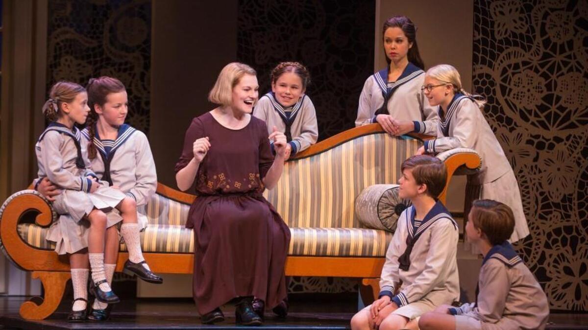 Kerstin Anderson plays Maria Rainer in “The Sound of Music.” The actors playing the von Trapp children from left: Audrey Bennett, Maria Knasel, Mackenzie Currie, Paige Silvester, Svea Johnson, Erich Schuett and Quinn Erickson.