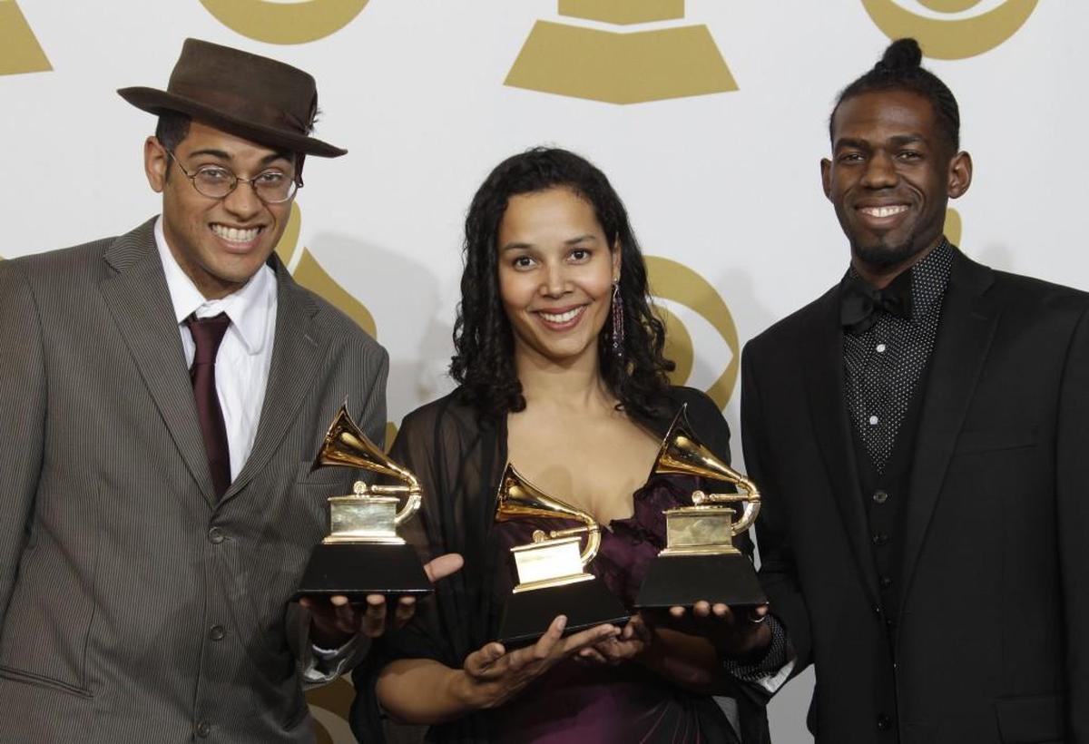 Carolina Chocolate Drops – Dom Flemons, Rhiannon Giddens and Justin Robinson – hold their Grammy Awards for best traditional folk album. They won the Grammy Award in 2010 for “Genuine Negro Jig.”