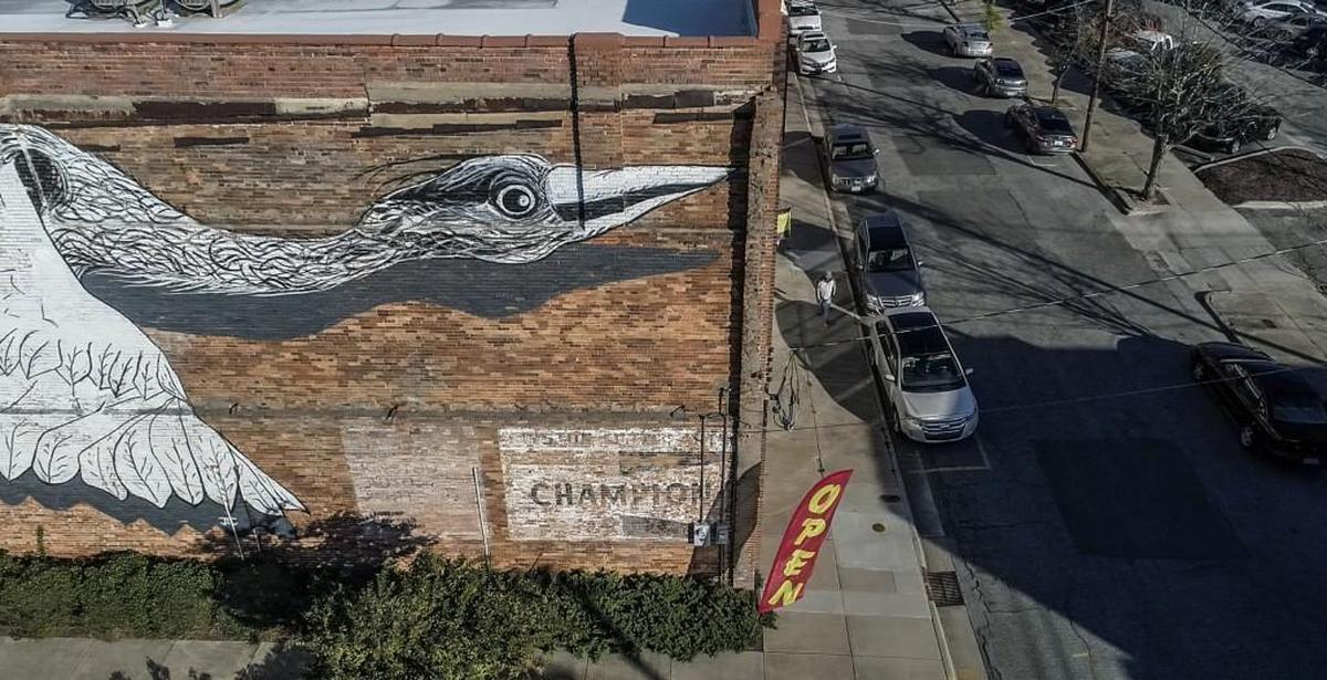 A large scale mural on the old NAPA Building in downtown Kinston is one of many public art projects scattered around the town. Kinston is emerging as an unlikely arts hub in Eastern North Carolina.