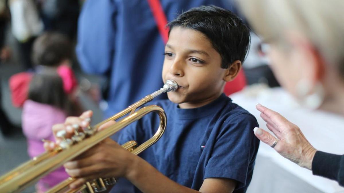 Mrenaal Jain plays the trumpet during “Instrument Zoo” at The N.C. Symphony in 2014 in Raleigh. Before its Young People’s Concerts at Meymandi Concert Hall in Raleigh, aimed at children age 4 to 12, families can visit an instrument zoo in the lobby that lets kids get a close-up look and hands-on experience with instruments most have never seen in person before.