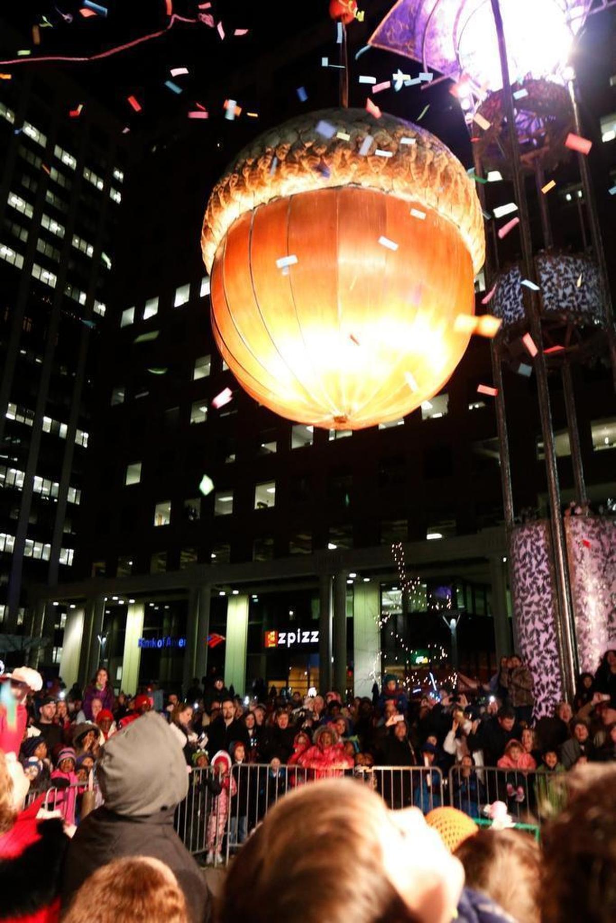 Raleigh First Night parents and their kids watch the acorn come down for the children’s early countdown to New Year’s on Fayetteville Street in downtown Raleigh at 7 p.m., December 31, 2014.