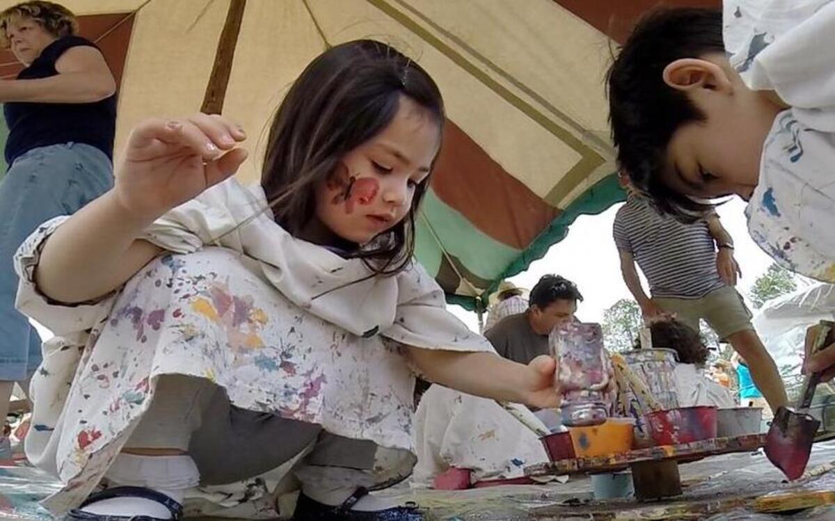
Children make art last year during the annual ClydeFEST Kids Carnival of Folk Art fun in Bynum, N.C. The event takes place this Saturday, May 2, 2015, from 11 a.m.-4 p.m. at Bynum’s ball field.
