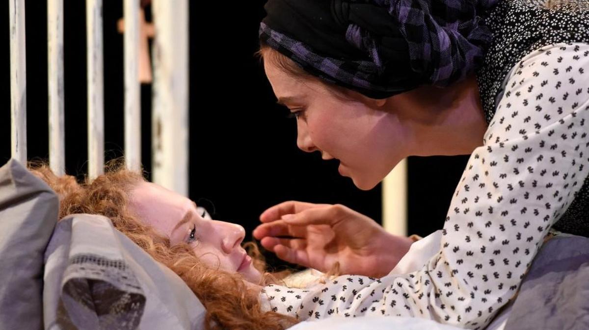 From left, Gabriella Cila as Betty Parris and Allison Altman as Abigail Williams in PlayMakers Repertory Company’s production of “The Crucible” by Arthur Miller.
