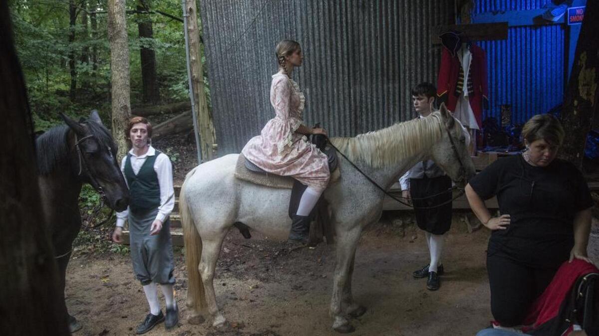 
Actors and stagehands take their places backstage during a performance of "American Patriots," a play that portrays the struggles North Carolina Quakers faced leading up to the American Revolution Thursday, July 30, 2015 at Snow Camp Theater in Snow Camp.
