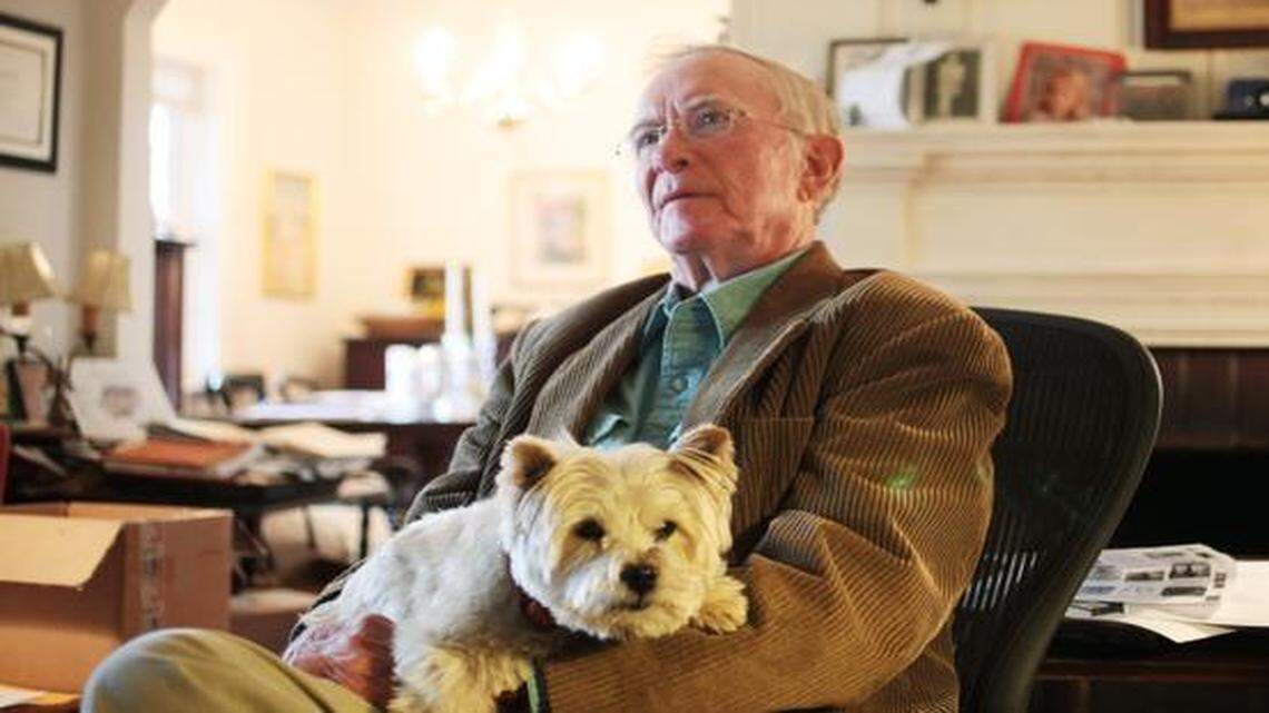 
Shelby Stephenson holds his dog, Cricket, in his study. The poet has published more than a dozen books filled with his poems. 
