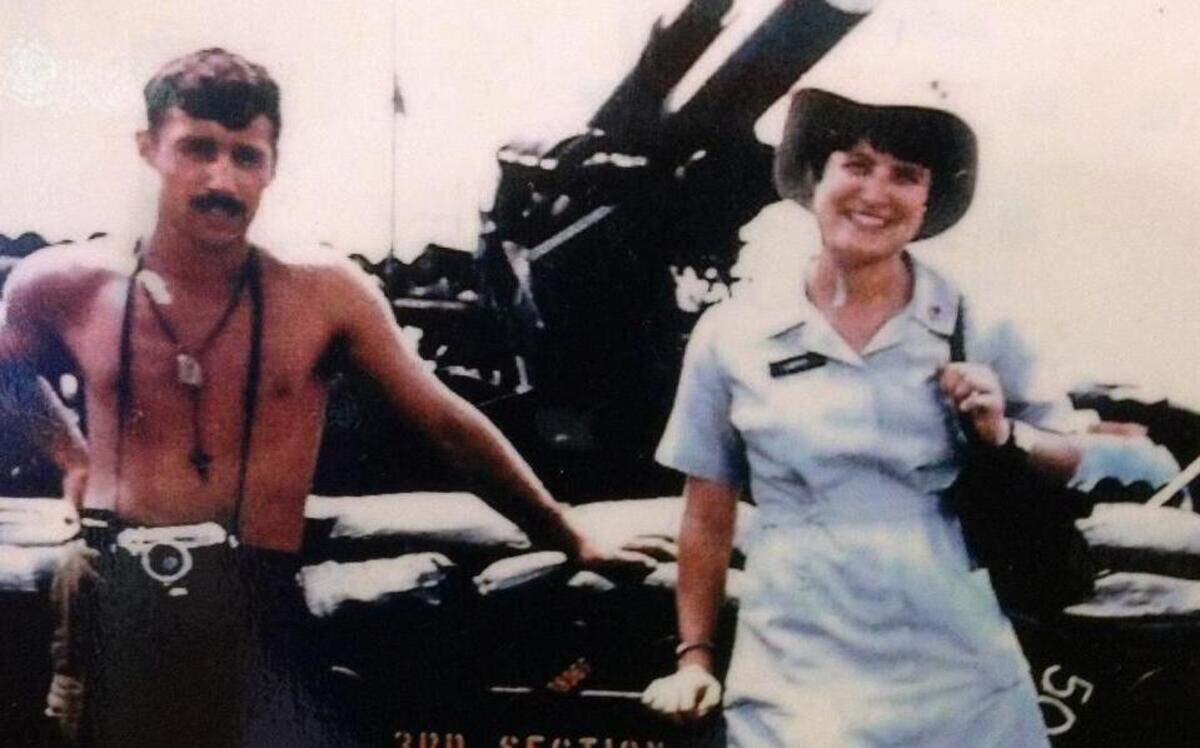 
Donut Dolly Mary “Larry” Young Hines poses for a photo with an unidentified soldier in front of a 105mm Howitzer field artillery gun during the Vietnam War. Hines volunteered for the Red Cross recreation program from 1968-69, serving mostly in the area surrounding Chu Lai and Phu Bai in central Vietnam. The Red Cross wasn’t “looking for a Beyonce or Kim Kardashian,” she said. “They were looking for the girl next door.”
