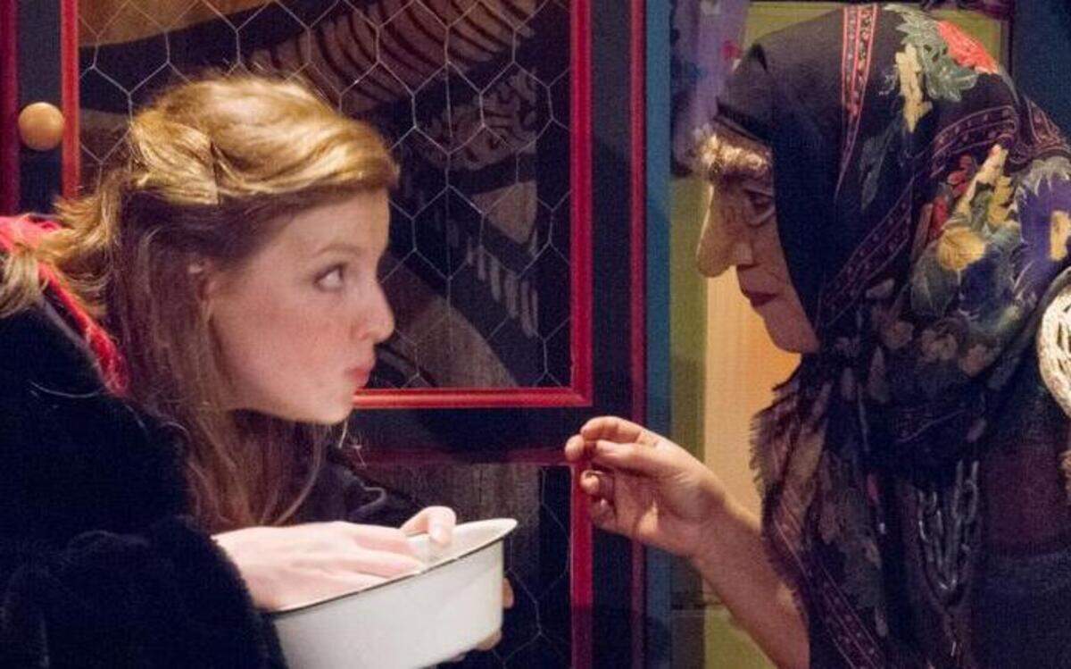 
Annie the American played by Faye Goodwin, left, is fed by her "not quite Auntie Yaroslava" (also known as Baba Yaga), played by Carly Prentis Jones in Manbites Dog Theater’s production of “The Fairytale Lives of Russian Girls.” 
