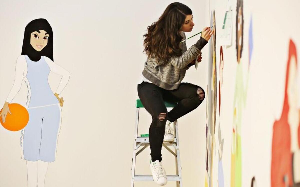 Artist Dorian Lynde paints her murals directly on the walls at CAM in Raleigh on Friday, May 19, 2017. Lynde’s reimagining of iconic heroines from classic Walt Disney movies are the subject of her exhibit, "No Damsel.”