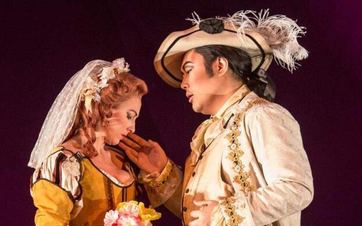 
Don Giovanni played by Jeongcheol Cha, right, charms Zerlina played by Jennifer Cherest in North Carolina Opera’s production of “Don Giovanni.”

