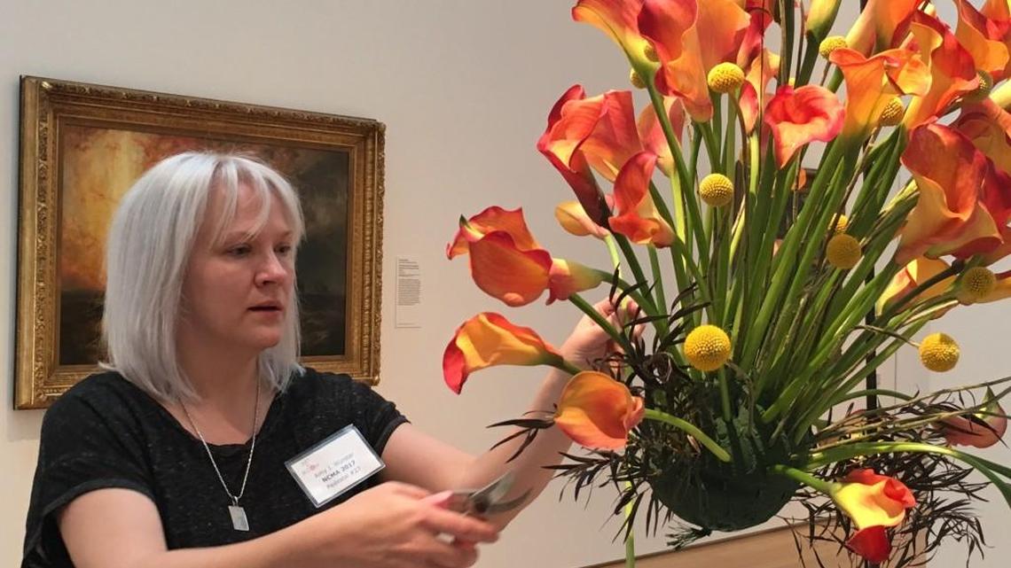 Amy Wurster of Knots ’N Such in Hillsborough makes one of 60 works of floral art that is on display during the N.C. Museum of Art’s “Art in Bloom” exhibit, which runs Thursday through Sunday in Raleigh.