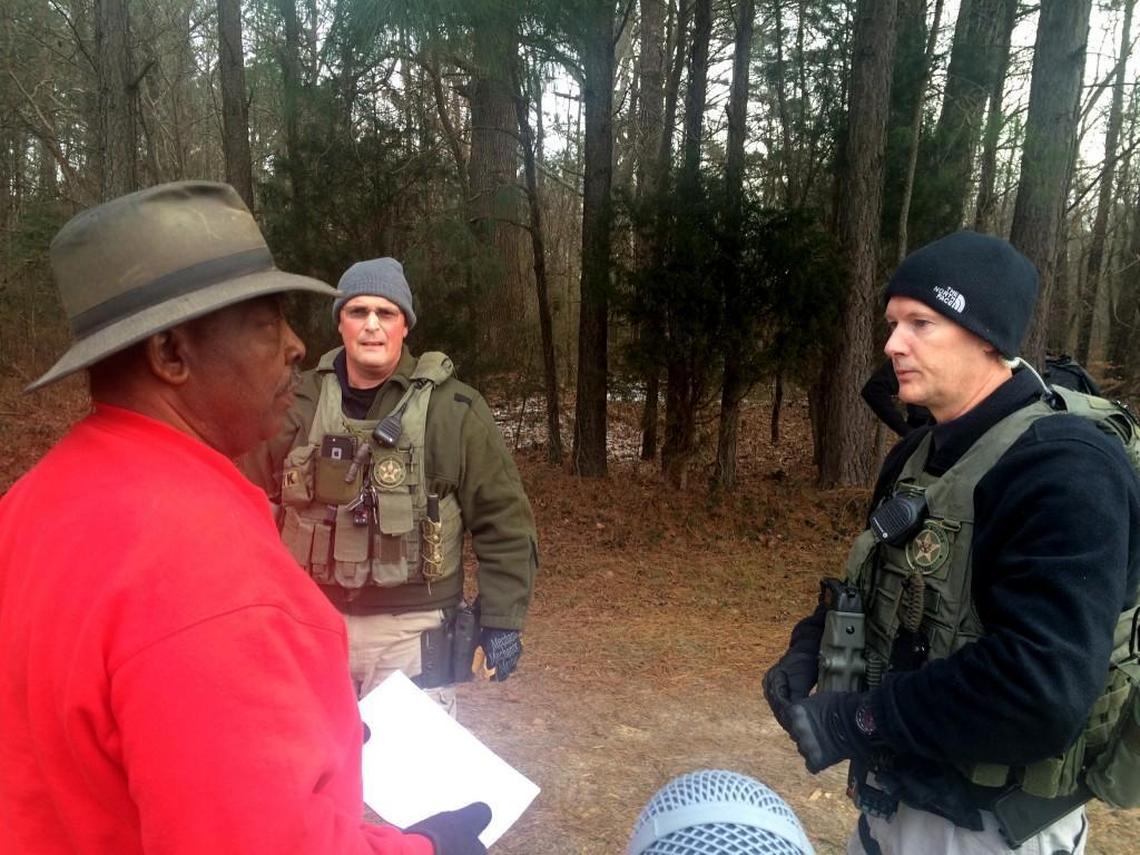 Eddie Wise, far left, is photographed by John Biewen, the audio program director at the Center for Documentary Studies at Duke University, while Biewan works on a story about a North Carolina farm couple being evicted from their farm in 2016 which was the subject of a recent episode on the podcast, Scene on Radio.