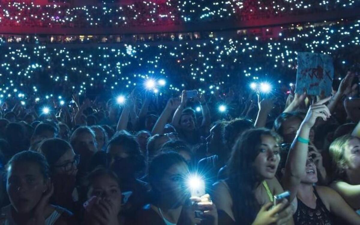 
Use your cellphone to take a photo at an outdoor concert, but not during live theater. 
