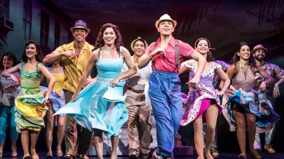 From left, Christie Prades as Gloria Estefan and Adriel Flete and Company in “On Your Feet!” The musical, based on a book about Gloria and Emilio Estefan, kicked off on Broadway in 2014 and tells the story of Gloria’s rise from a child in Cuba – fleeing the Cuban Revolution to Miami – to becoming one of pop music’s most enduring figures, alongside husband and collaborator, Emilio.