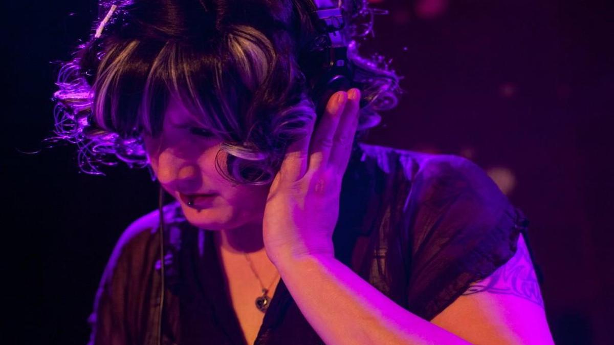
Emmett Davenport monitors sound during her joint performance as That Darling DJ Duo at The Pinhook in Durham, NC, on Friday, July 3, 2015. Emmett Davenport lives a double life as the creator of "Clockwork Cabaret," a steampunk podcast, and also as the owner of Cafe Diem in Pittsboro, NC.
