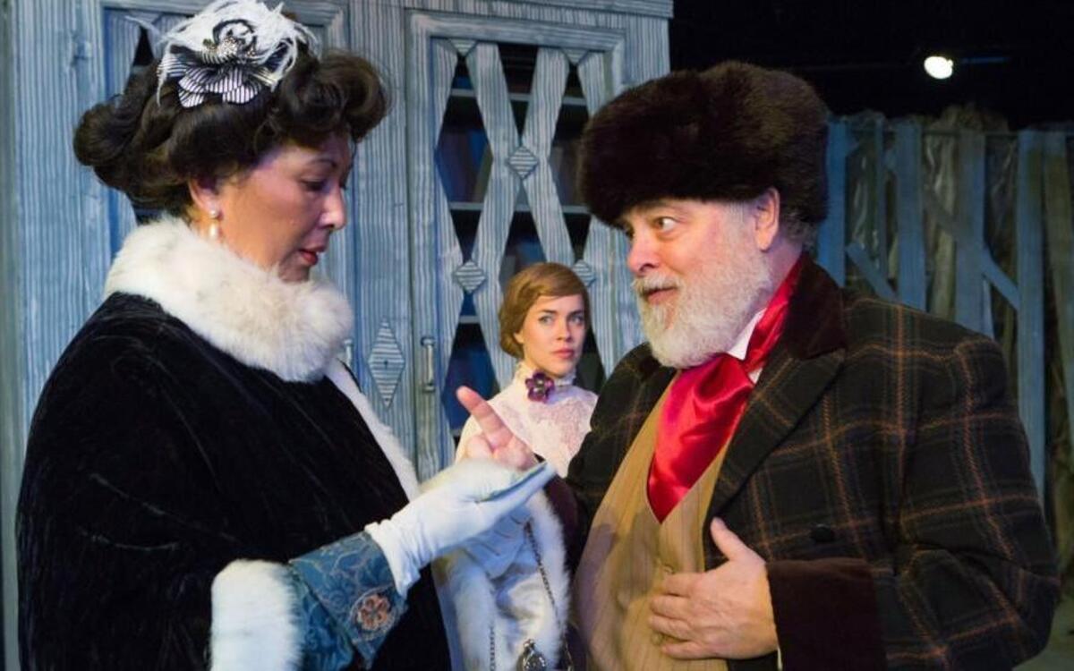 Foreground from left, Dorothy Recasner Brown, Fred Corlett, and Maryanne Henderson, background, in Deep Dish Repertory’s production of “The Cherry Orchard.”