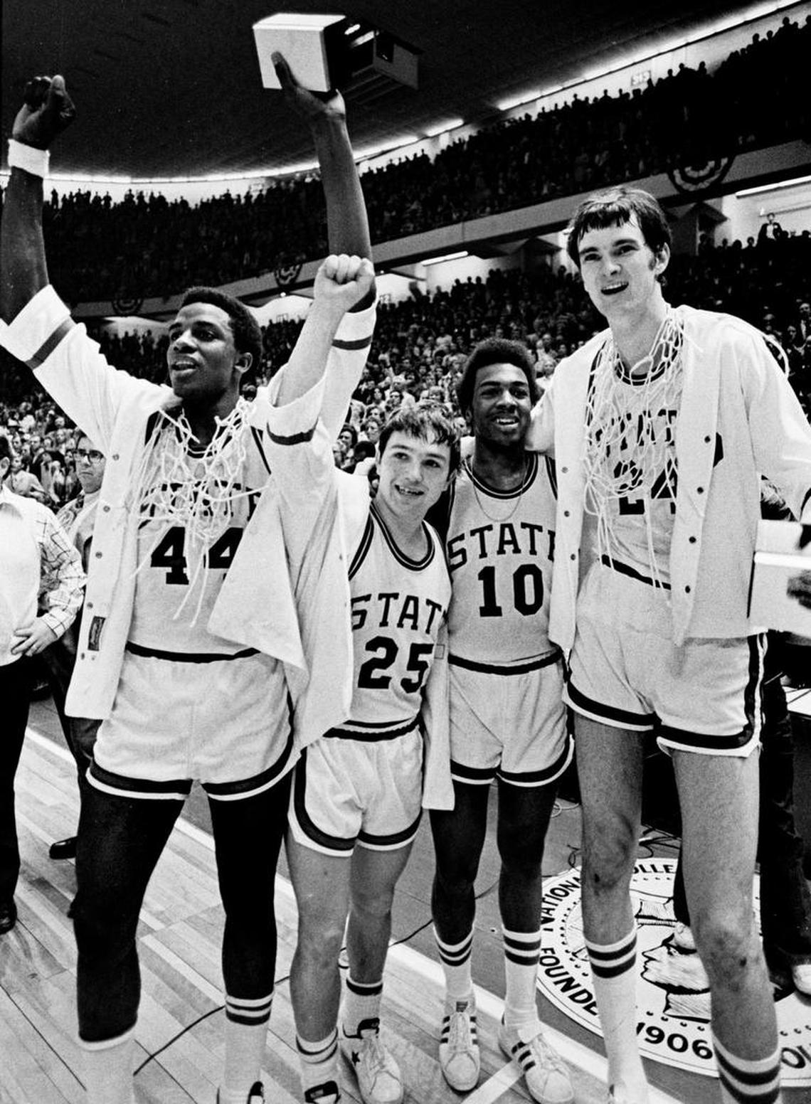 NC State’s David Thompson, Monte Towe, Mo Rivers and Tommy Burleson celebrate after the 1974 Wolfpack defeated Marquette to win the NCAA men’s basketball championship.