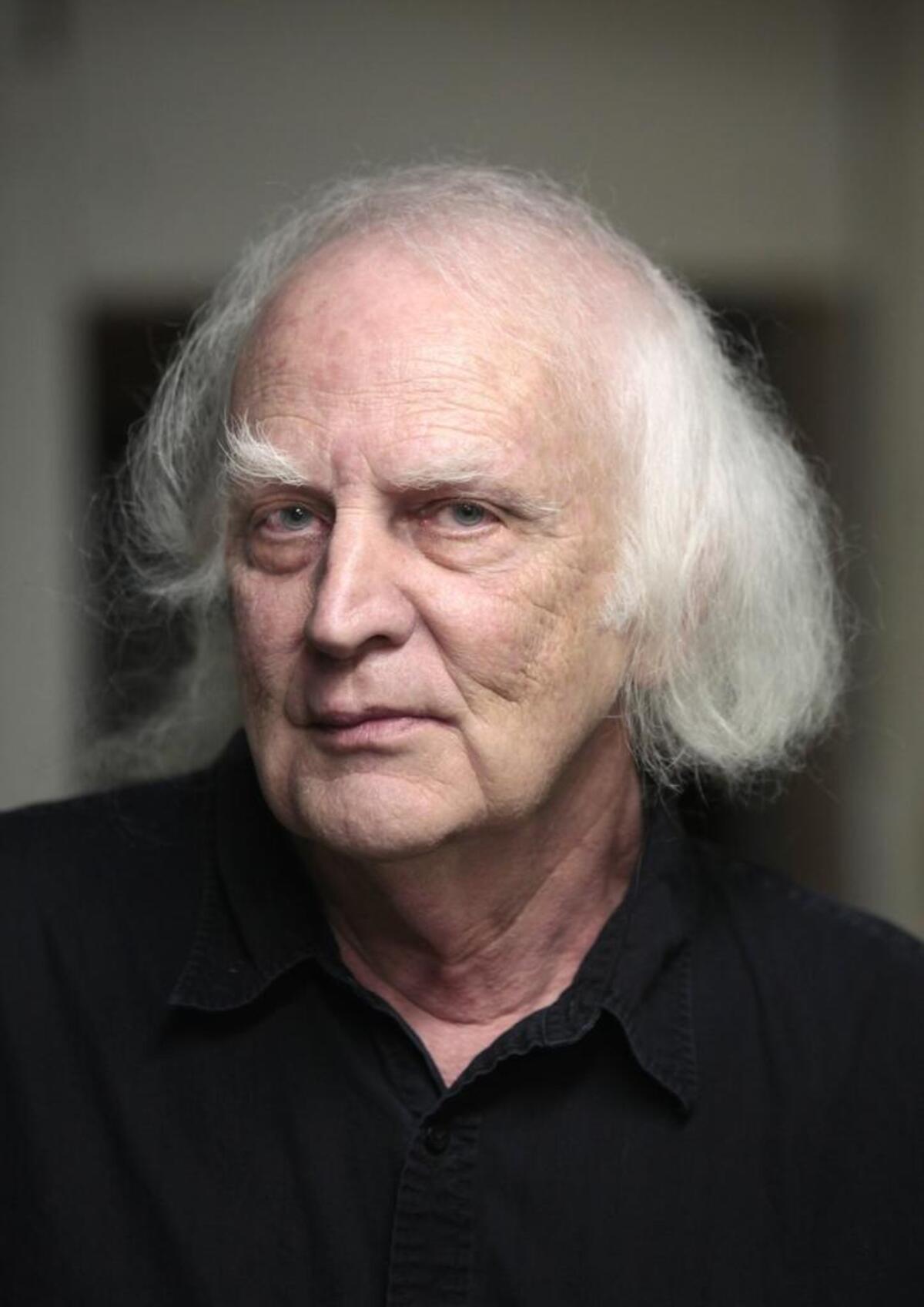 Portrait of Chelsea Theater owner Bruce Stone in his theater's projection room, August 23, 2013.