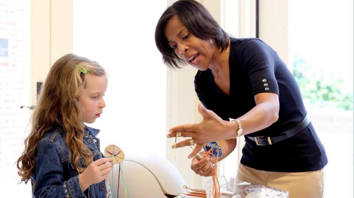 There will be hands-on arts and crafts at Cary’s Dreamfest at the Cary Arts Center Jan. 13. In this photo from the 2016 event, Melody Hunter-Pillion, right, assists Maya Ver, 6, with a craft Cary's multi-day Dreamfest celebration honoring Martin Luther King Jr