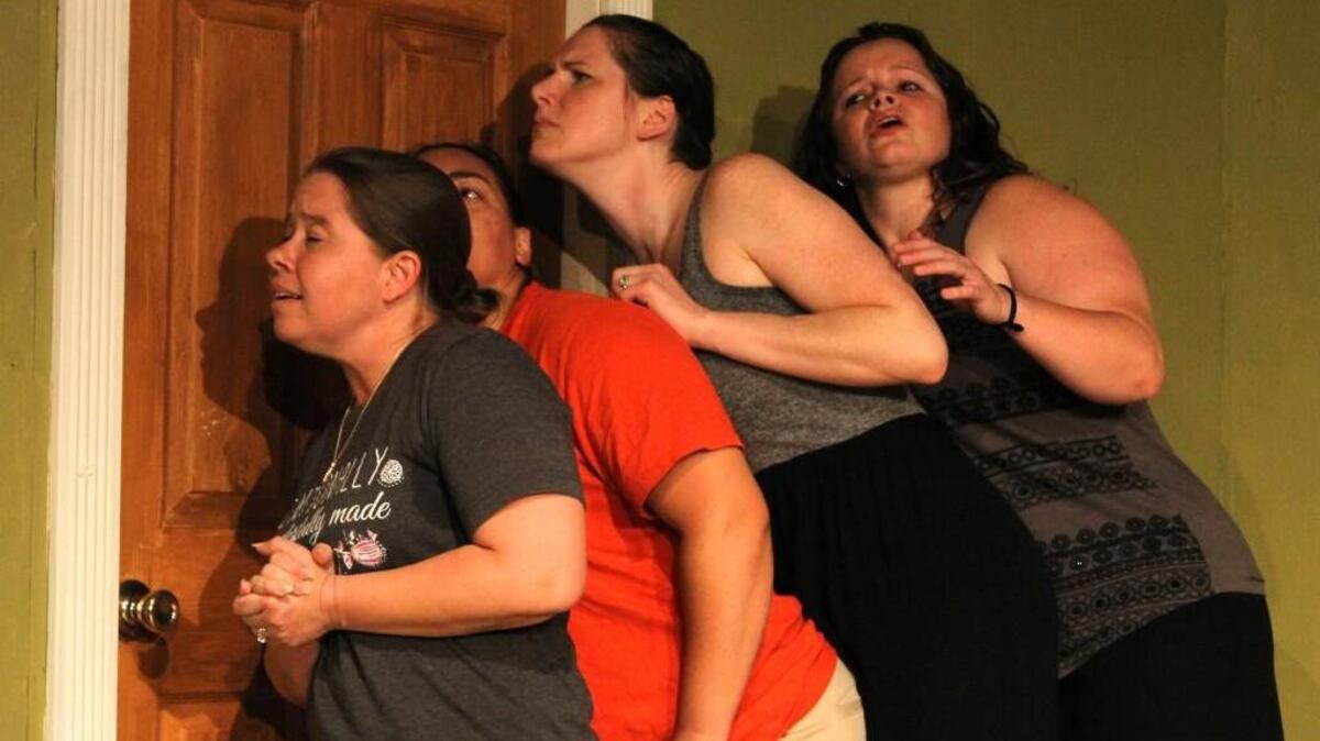 From left, Bethany Ruffino, Chela Cayes, Jennifer Hinton-Marion and Laurie Cherry crowd against a dressing room door to listen for a reluctant bride in a scene from “Always a Bridesmaid.”