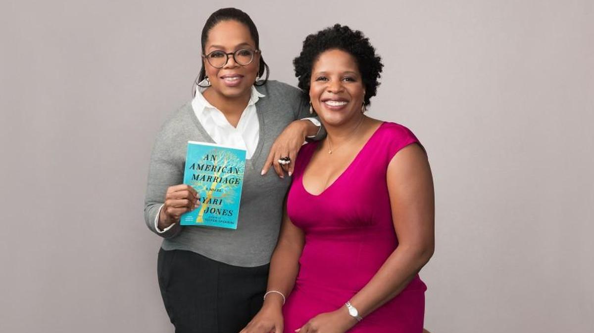 Oprah Winfrey, left, poses for a portrait with author Tayari Jones in New York Nov. 2, 2017. While Jones learned in the fall that her book, “An American Marriage” would be the newest selection of Oprah’s Book Club, she had to wait until February for the announcement.