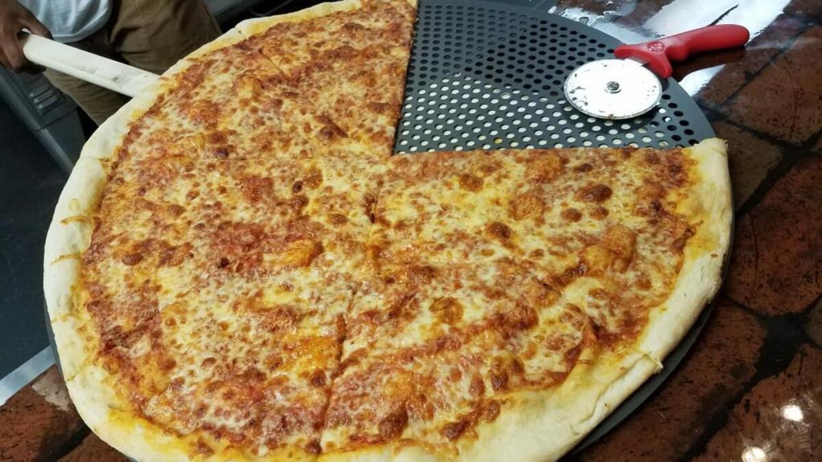 The pizza at Benny Capitale’s in downtown Raleigh is 28 inches across in diameter and has eight slices. A cheese slice is $4, or it’s $5 for a slice with pepperoni, sausage, garlic mushroom or Wild Bill (chicken).