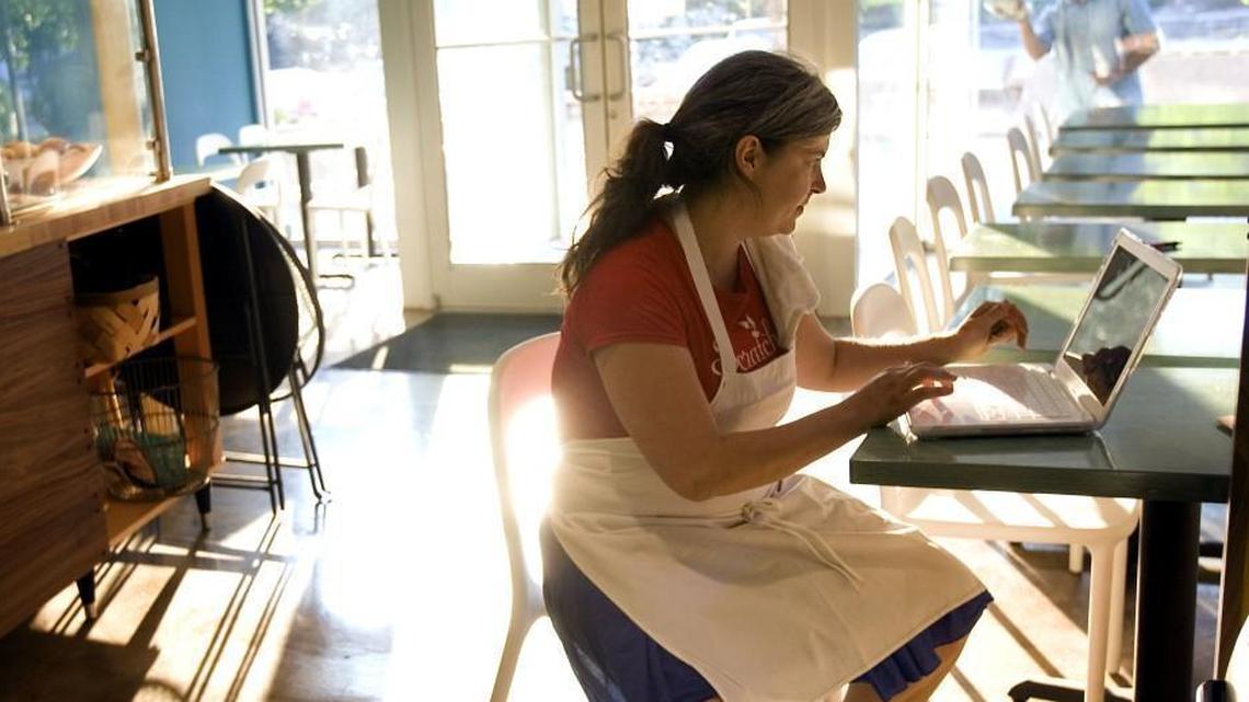 Phoebe Lawless, pictured in 2010 when Scratch Bakery first opened, prints a menu.