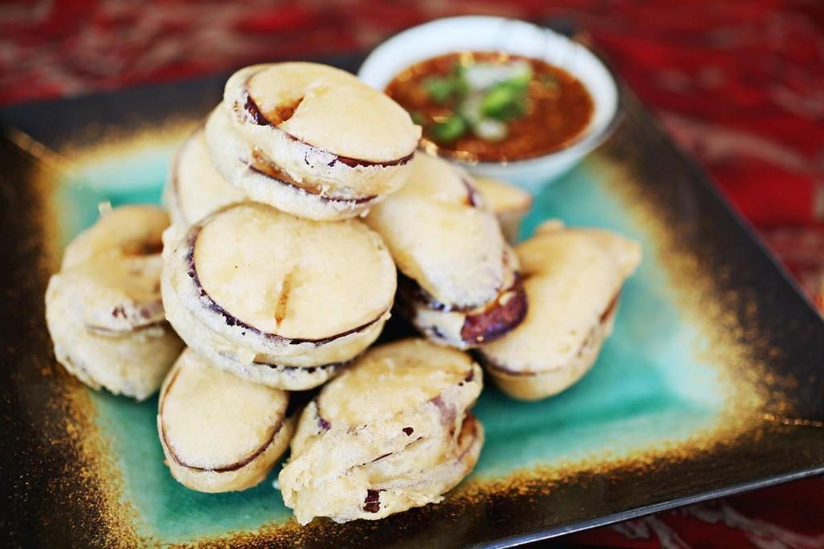 The Fried Eggplant “Boxes” served as an entree adapts beautifully as a shared starter: chunks of eggplant stuffed with minced pork and chives, then fried in a tempura-like batter and served with a spicy dipping sauce on the side at Szechuan Garden in Morrisville.