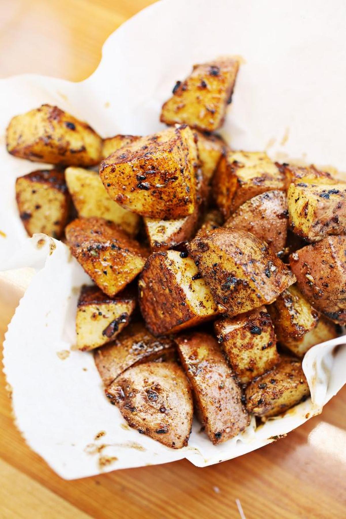 454 Grill food truck’s rotating sides include the garlicky Cajun-spiced home fries.