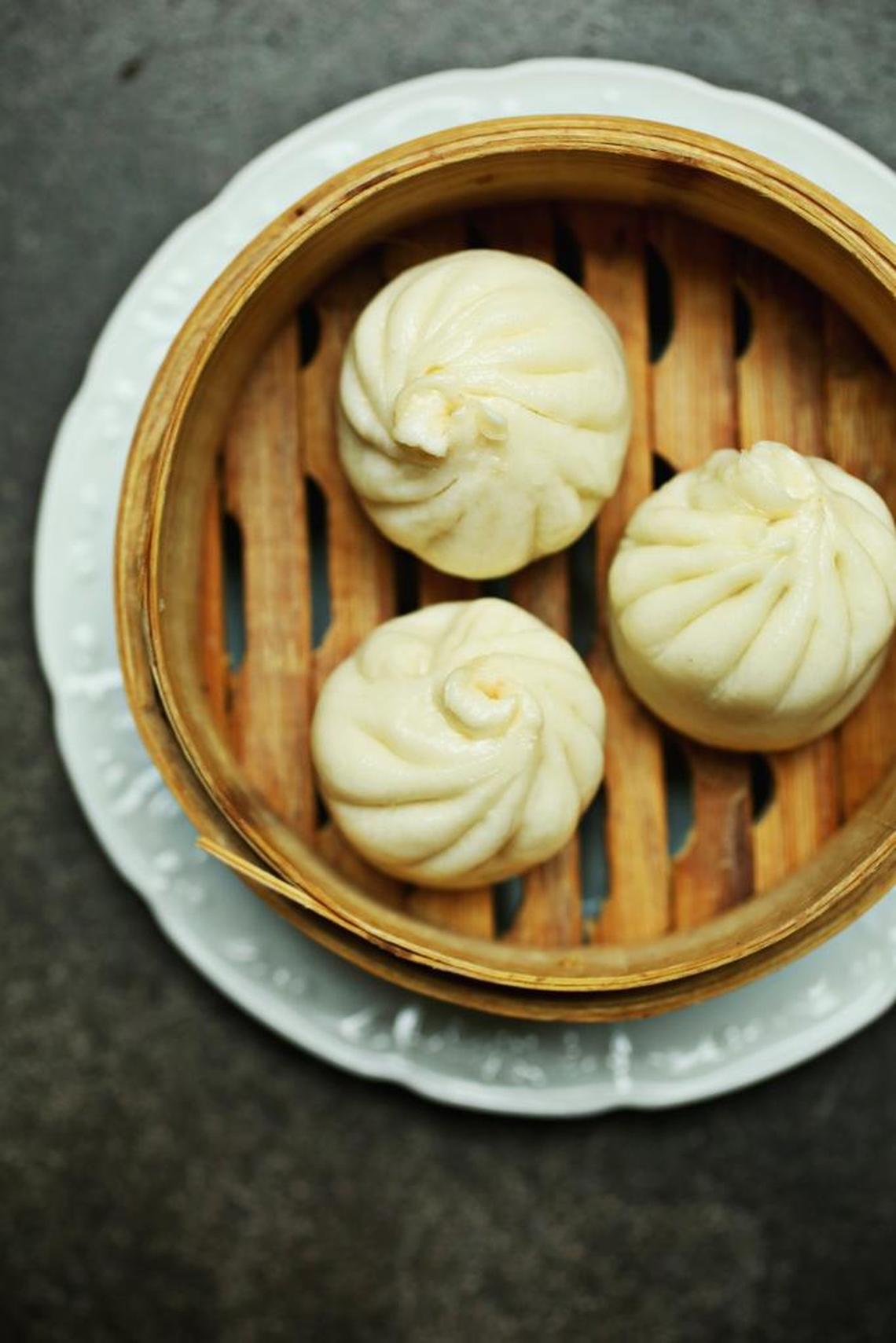 Brewery Bhavana's two renditions of bao — steamed buns filled with char siu, or delicately pan-browned with a filling of braised pork and black mushrooms — are both so good that they leave you no option but to order both.