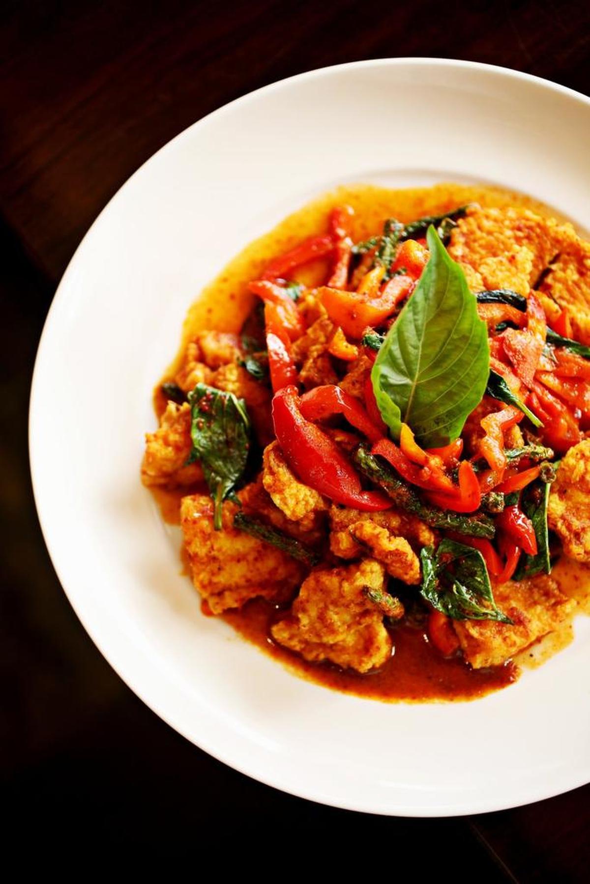 The Pad Prik Catfish is deep-fried catfish stirred with red bell peppers, green beans and basil in prik khing sauce at Bua Thai Cuisine in Durham.
