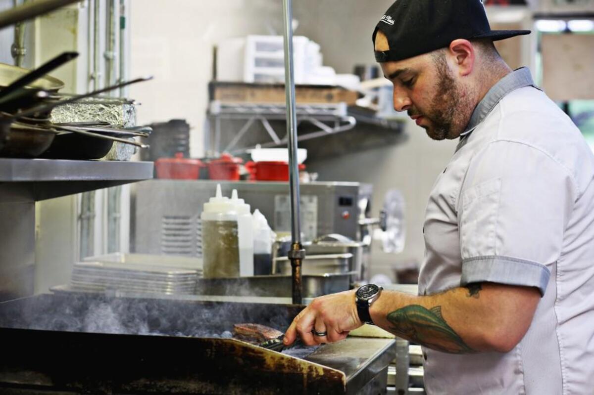 Executive chef Jeff Seizer prepares Duck A L’orange at Royale in Raleigh on Tuesday, April 18, 2017.