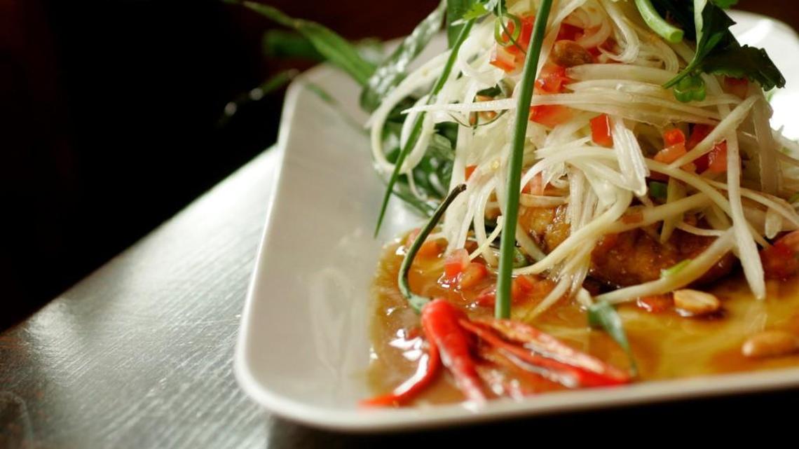 The Thai barbecued pike, served with green papaya salad, is a dish found at Bu.ku in downtown Raleigh. A second location will open this spring in Wake Forest.