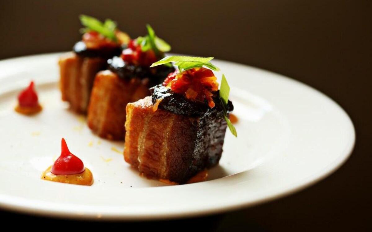 Academy Street Bistro's new chef and owner Tom Havrish punctuates pork belly’s stratified layers of crunch and unctuousness with garlic-tomato-bacon jam and a vibrant roasted pepper relish.