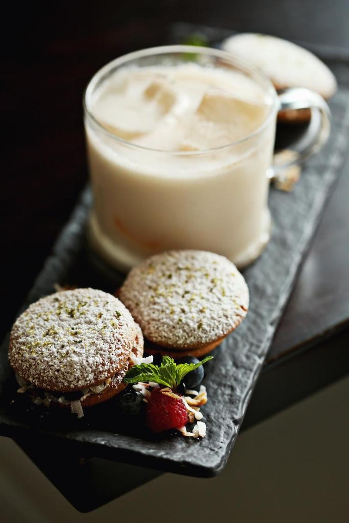 The elegant horchata-and-alfajores play on milk and cookies is made up of chocolate orange ganache, dulce de leche, toasted coconut and horchata at so.ca in Raleigh.