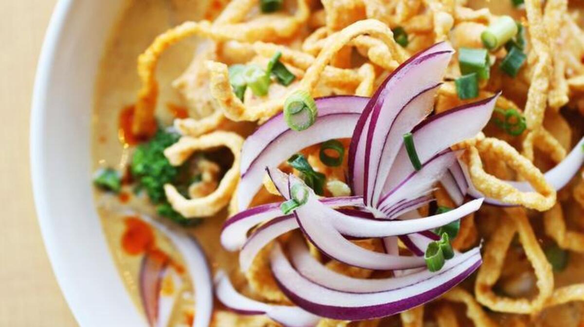 Khao Soy (aka Chiangmai noodles), which serves up chicken and egg noodles in a red curry sauce, showered with crispy noodles and red onion, is on the specialty menu at Baan Thai in Apex.