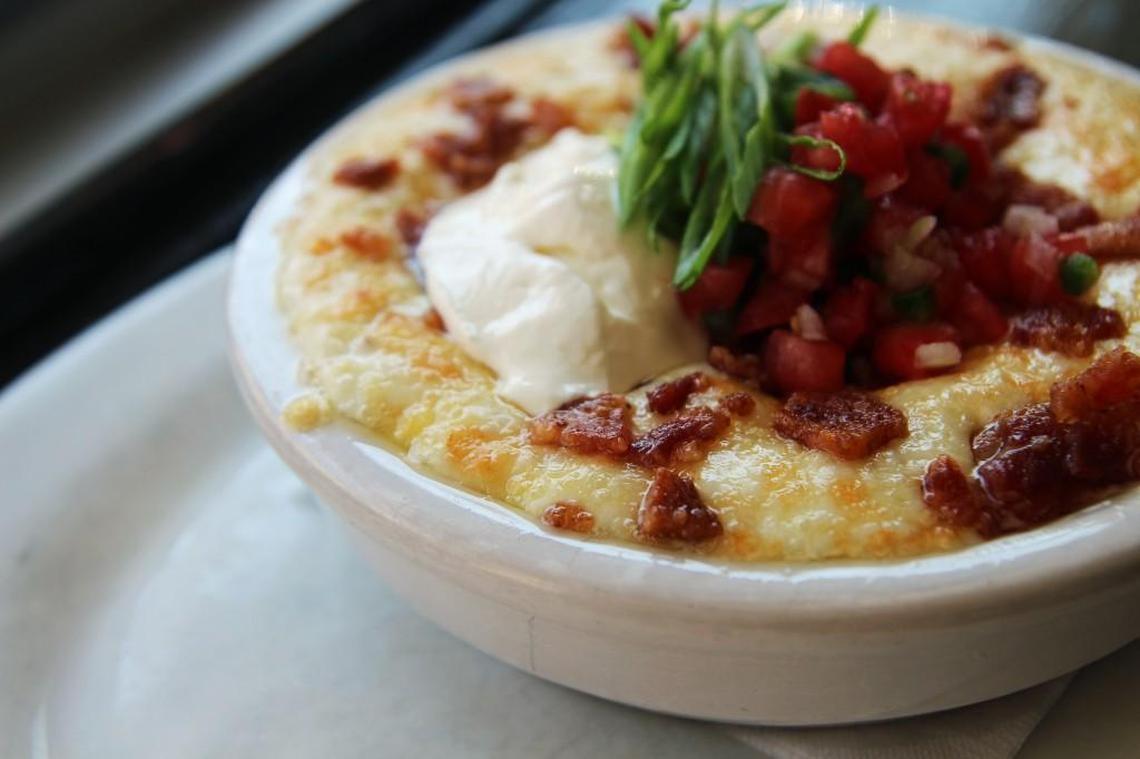 Poole’s Diner will begin serving brunch on weekends again starting Saturday, April 1. The menu will include hangover grits with cheese and bacon (pictured), biscuits and the gravy of the day, seasonal hotcake, eggs Benedict (with porchetta), shrimp and grits and a croissant Croque Madame.
