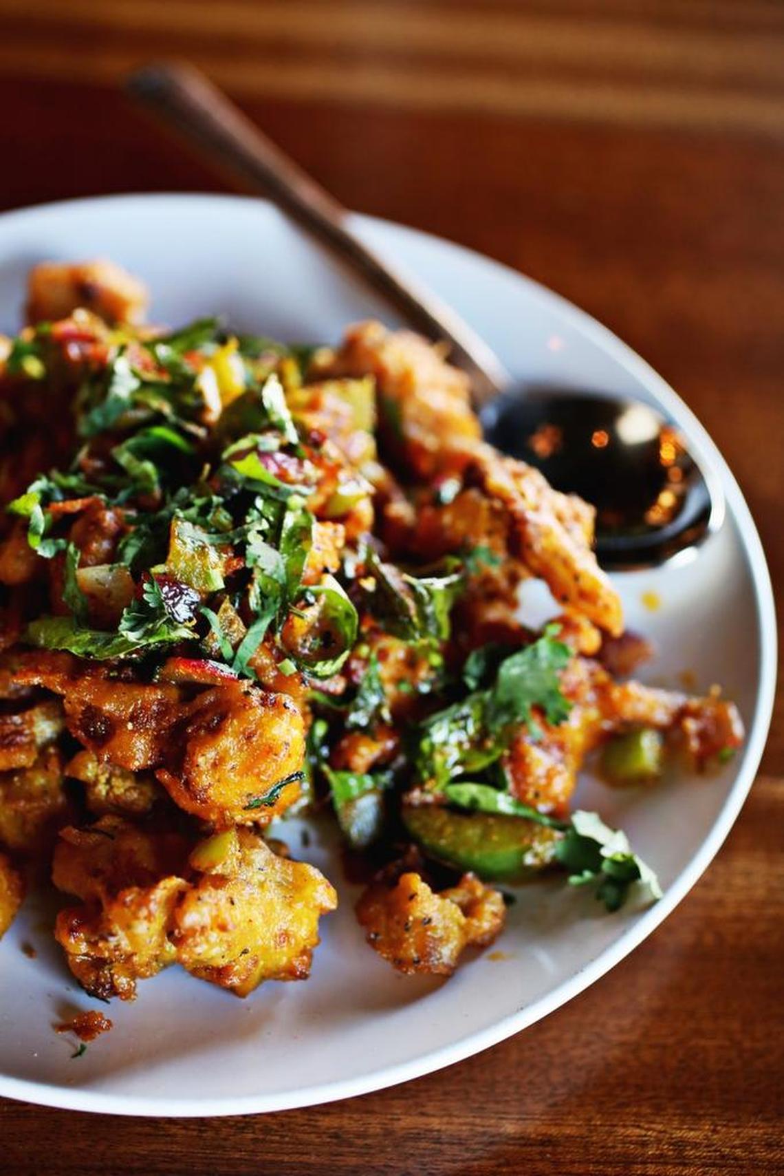 Gobi suka, crispy batter-fried cauliflower florets sautéed with onions, peppers and curry leaves, are an addictive starter at Viceroy.