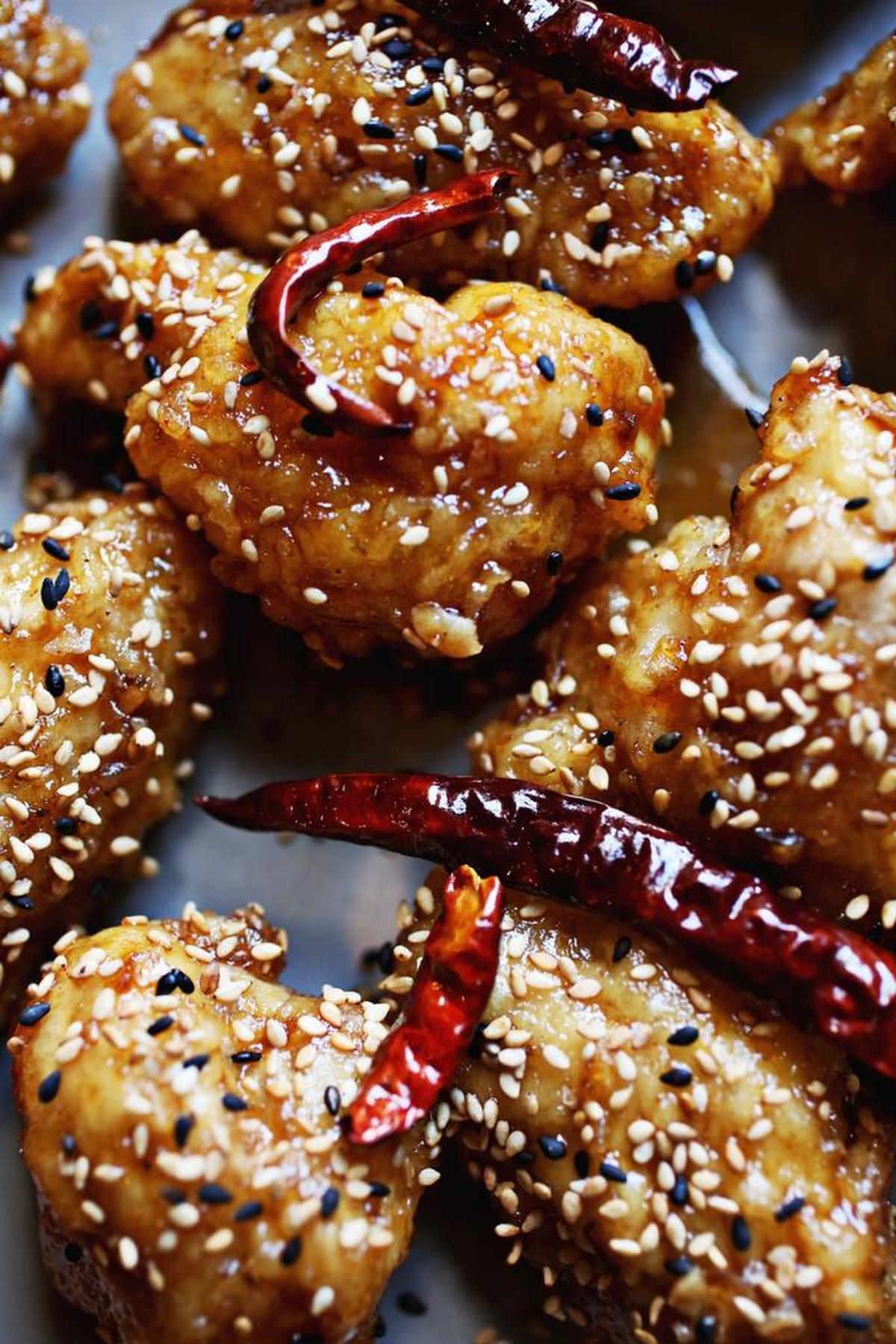 The house specialty at M Kokko is “KFC” wings, the K standing for Korean — as in that country’s famously extra-crispy twice-fried chicken. Twelve bucks gets you eight wings, glazed with a classic soy-garlic sauce or a spicy-sweet sauce riddled with freshly toasted red chiles.