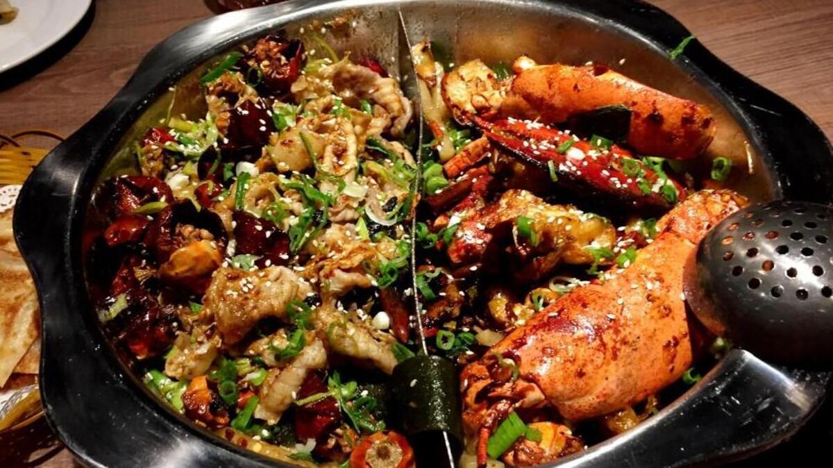 The dry hot pots (or simply, dry pots) are one of the specialties at Good Harvest in Cary. These shareable pots, essentially stir-fries or stews made with your choice from a varied selection of fresh fish and shellfish (in a few cases, taken straight from one of those tanks near the entrance), arrive fully cooked at the table. This one has golden pepper crisp fish on left and lobster on the right.