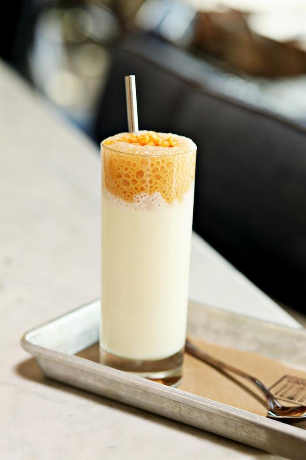 Standard Foods serves a playful take on the milkshake made with Carolina Gold rice ice cream, topped with whipped dulce de leche and puffed rice.