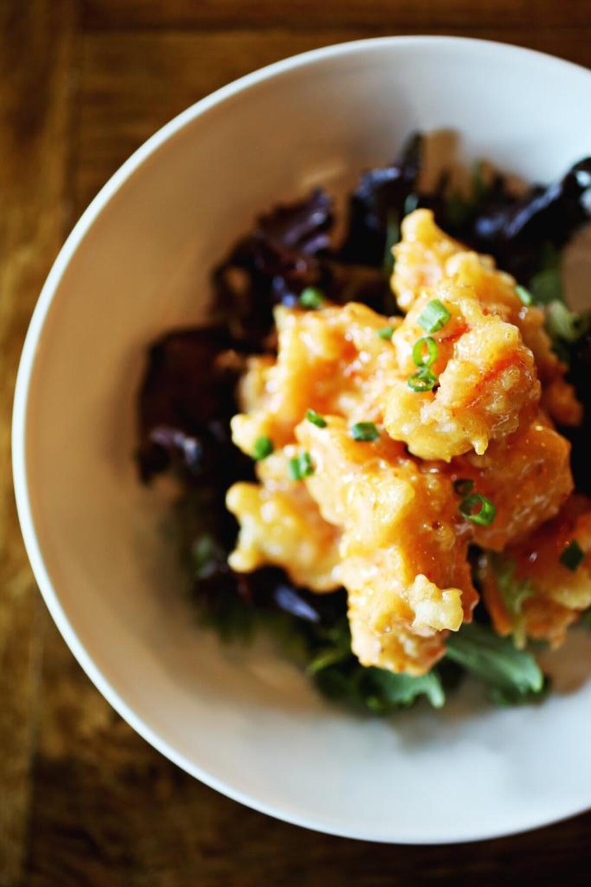 Eighty 8 Asian Bistro's Firecracker Shrimp is the familiar dish of batter-fried shrimp tossed in a blend of mayo, Sriracha and sweet chile sauce that sushi fans will recognize by yet another name: dynamite sauce.